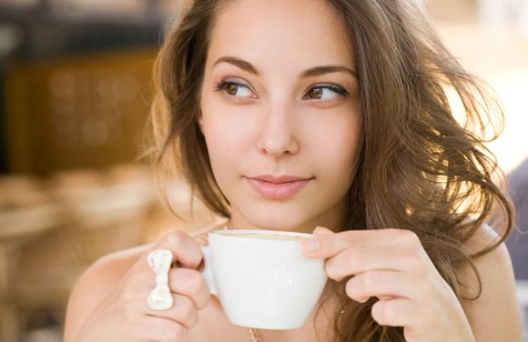 young-brunette-enjoying-cup-of-coffee-thinatamil